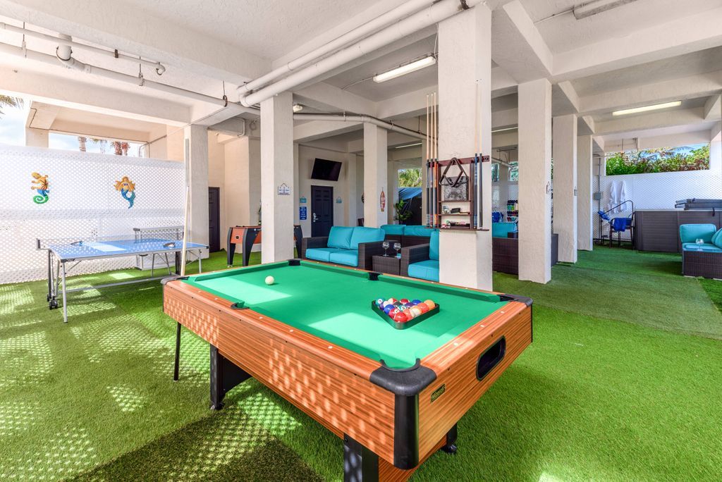 Billiards table with green felt in recreation area